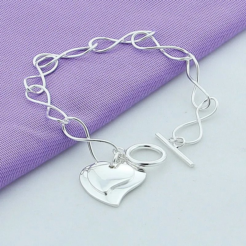 Pulsera DOTEFFIL de plata de ley 925 con dos corazones para mujer, ideal como amuleto para boda, compromiso o fiesta.