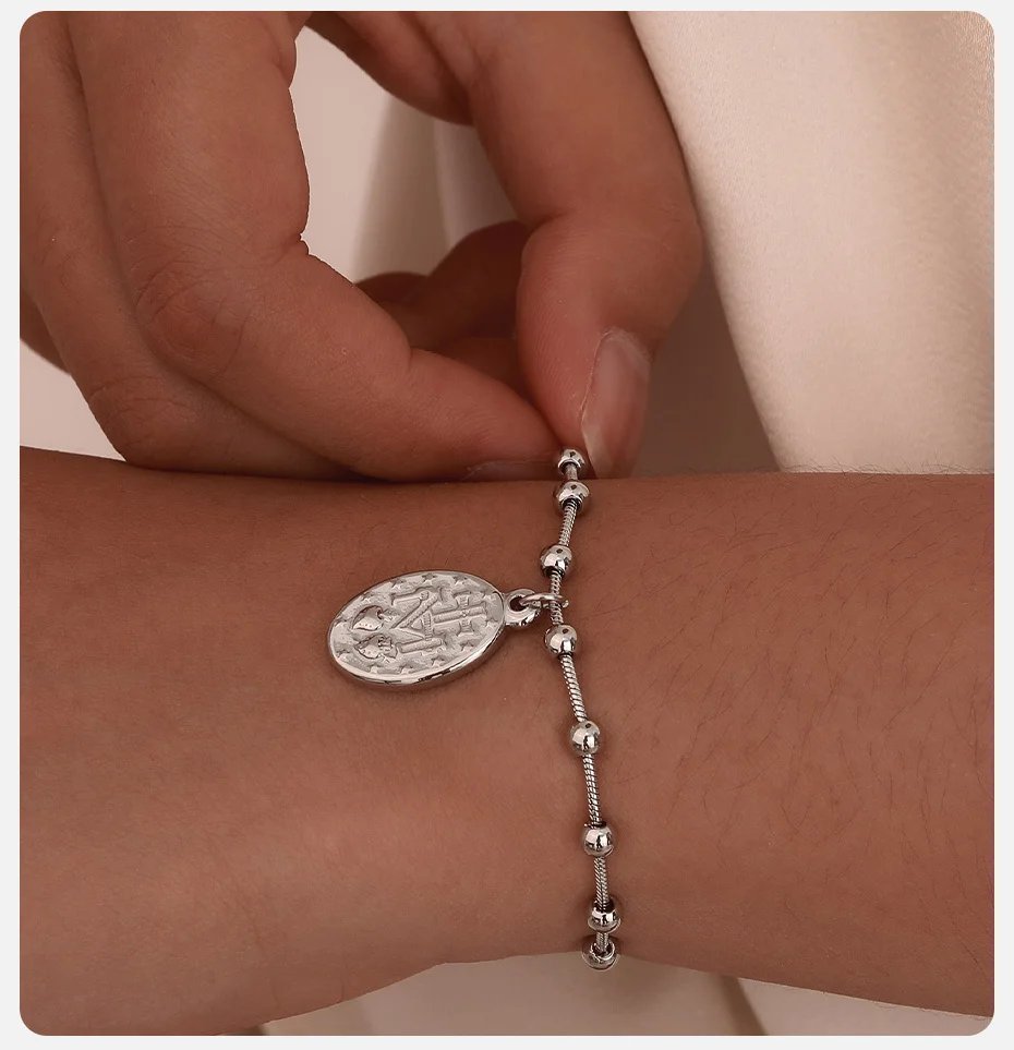 Pulsera de rosario Vnox para mujeres y niñas, de acero inoxidable chapado en oro, con cruz religiosa y oración de la Virgen María. Pulsera de rosario Vnox para mujeres y niñas, de acero inoxidable chapado en oro, con cruz religiosa y oración de la Virgen María.